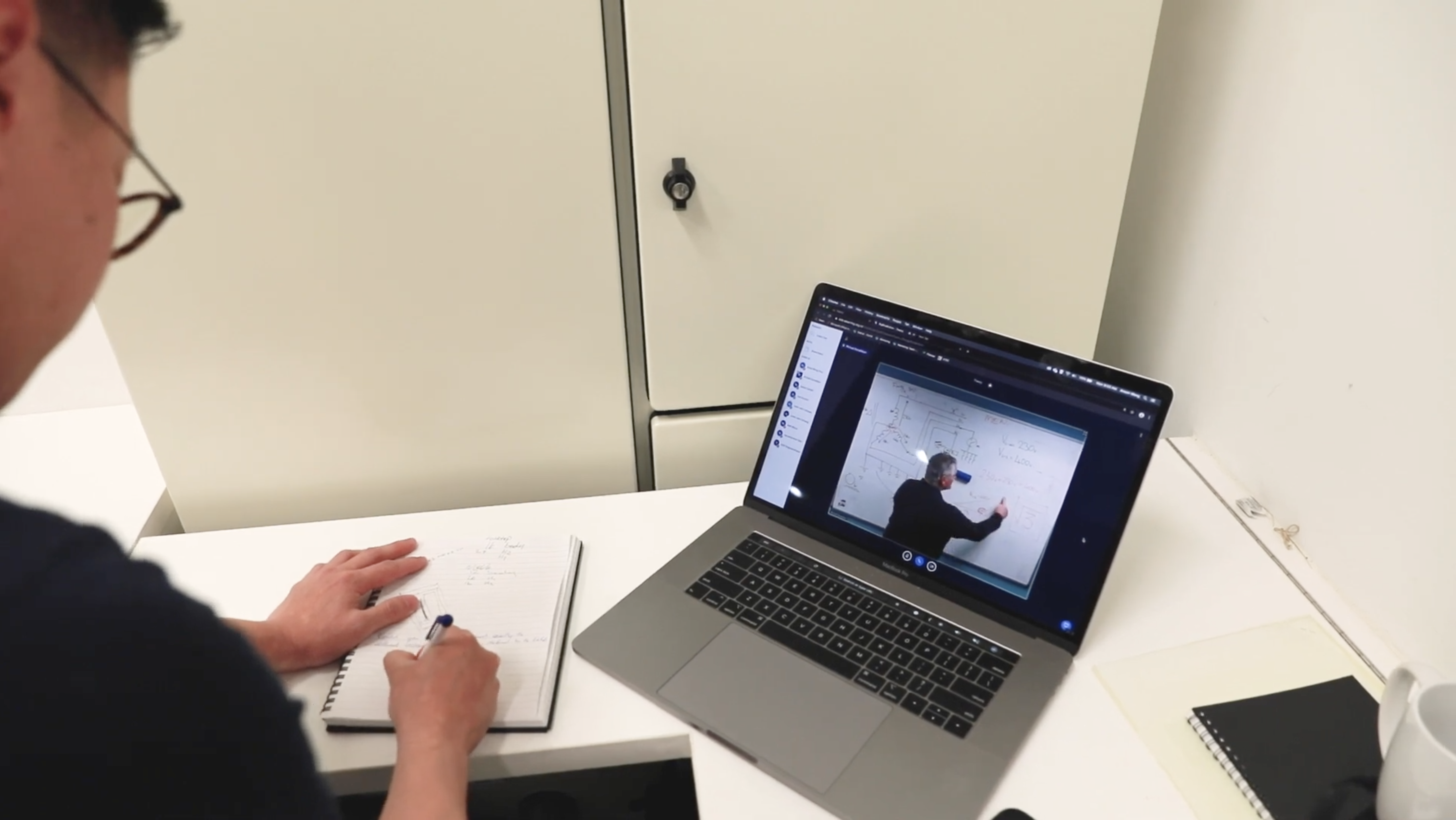 How different is attending E-tec’s Virtual classroom to a face-to-face learning experience Student watching a virtual class on his laptop